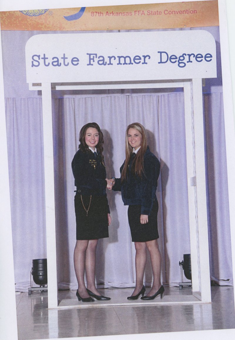 Submitted Photo Taylor McNeel, left, state FFA president, congratulates Katlynn Martin of the Gravette FFA for receiving the State Farmer Degree, the highest award the state FFA awards.