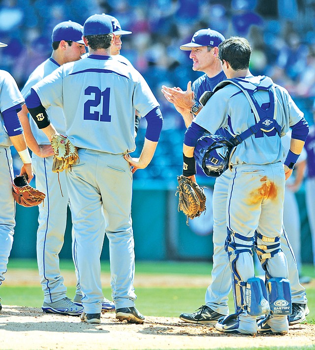 FILE PHOTO ANDY SHUPE Matt Melson, center-right, Rogers High baseball coach, has been selected to coach in the 11th annual Xtra-Innings Classic next month in Jonesboro.