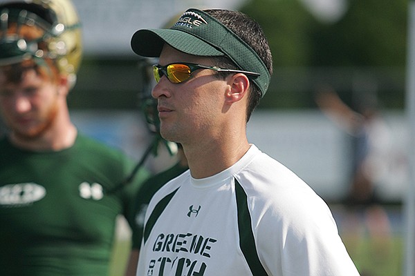 Greene County Tech head coach Jeff Conaway watches during his team's game against Calvary at the Elite 7 on 7 Showcase in Springdale on Saturday, July 9, 2011.