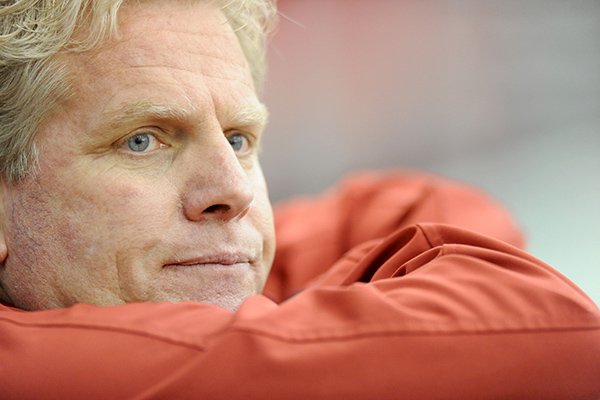 Arkansas men's track and field coach Chris Bucknam watches from the edge of the track Saturdray, Jan. 26, 2013, during the Razorback Invitational at the Randal Tyson Track Center in Fayetteville.