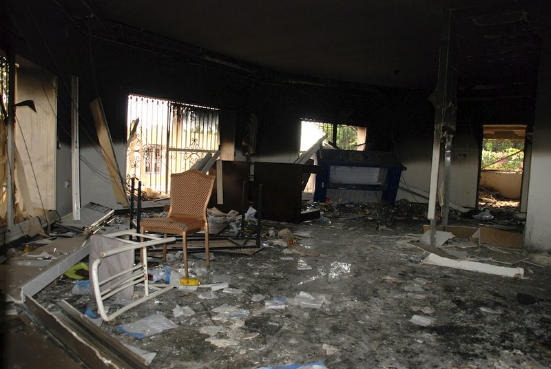 This Sept. 12, 2012, file photo shows glass, debris and overturned furniture are strewn inside a room in the gutted U.S. consulate in Benghazi, Libya, after an attack that killed four Americans, including Ambassador Chris Stevens. 