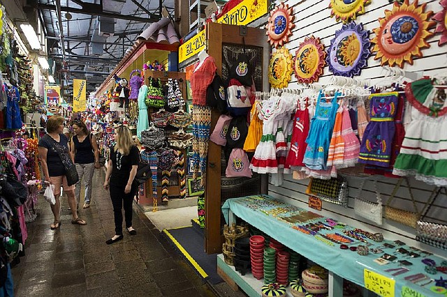 Shoppers browse for souvenirs at the Main Market in San Antonio earlier this month. “Inflation in the U.S. is in a sweet spot,” one analyst said Tuesday.