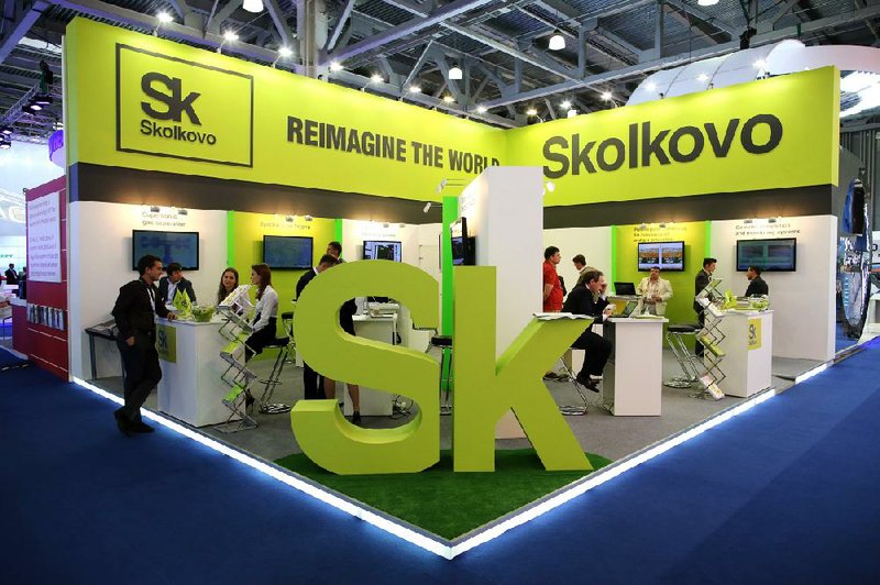 Visitors at the 21st World Petroleum Congress in Moscow gather at the Skolkovo Foundation display Monday. The foundation is a scientific and technological agency in Russia.
