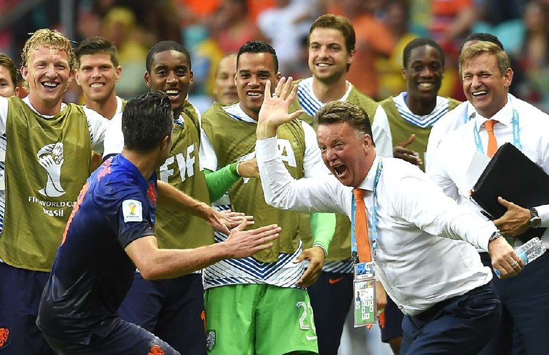 Dutch Coach Louis van Gaal (right) wouldn’t mind another victory like in Friday’s opener against Spain, but right now he just wants to see the field.