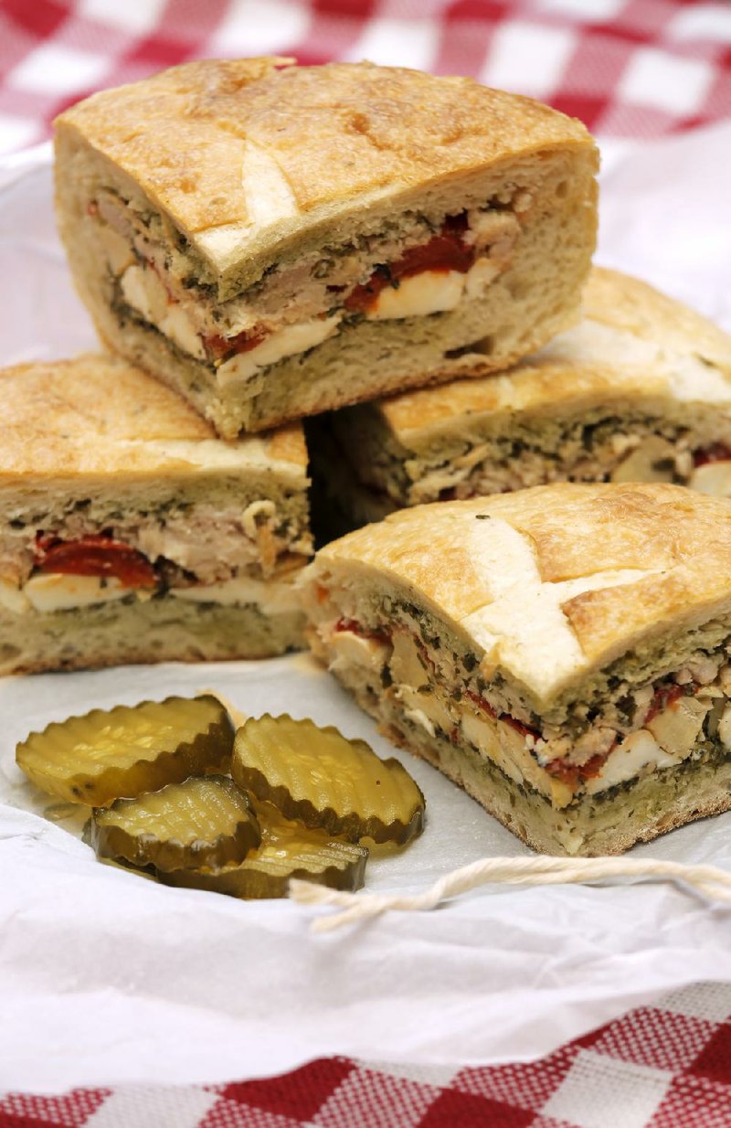 This Pressed Sandwich layers mozzarella cheese, marinated artichoke hearts, roasted red bell peppers and tuna.