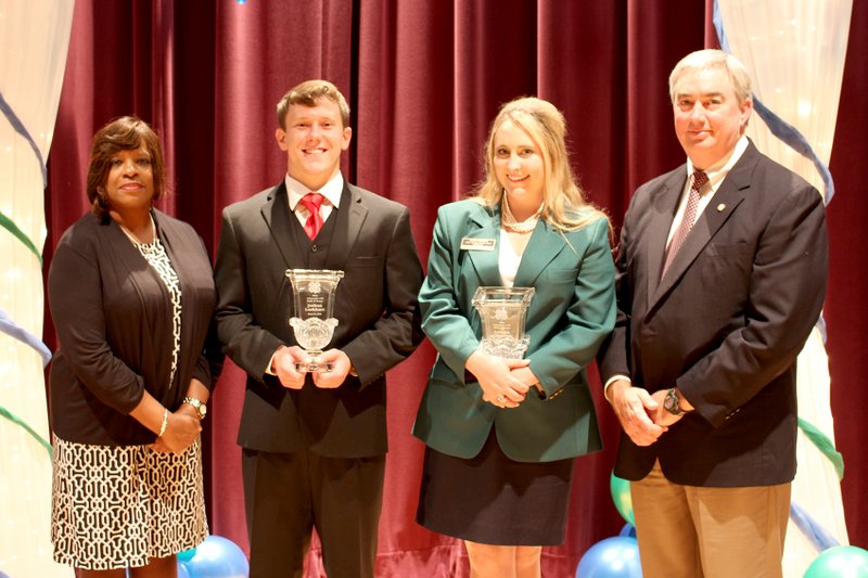 Submitted Photo/Arkansas 4-H Lauren Cheevers of Washington County (green jacket) and Joshua Lockhart of Benton County (dark jacket and vest) were inducted into the 2014 Arkansas 4-H Hall of Fame at the Arkansas 4-H Teen Star and Hall of Fame Banquet held on June 11 at the C.A. Vines Arkansas 4-H Center in Little Rock. Anne Sortor, associate director-4-H Youth Development and Family Consumer Science, and Tony Windham, associate vice president for Agriculture-Extension, presented the prestigious crystal vases to the inductees.