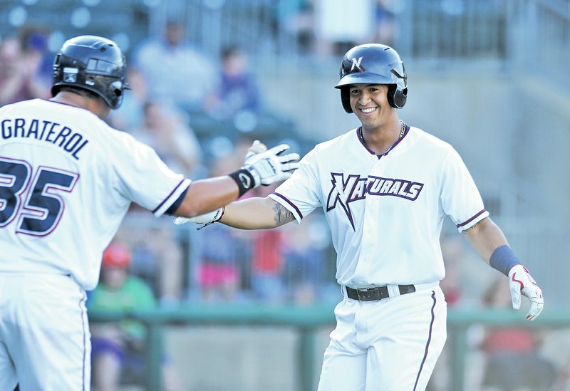  FILE PHOTO ANDY SHUPE Cheslor Cuthbert, Northwest Arkansas Naturals third baseman, celebrates a home run May 25 with Juan Graterol against Corpus Christi during the second inning at Arvest Ballpark in Springdale.
