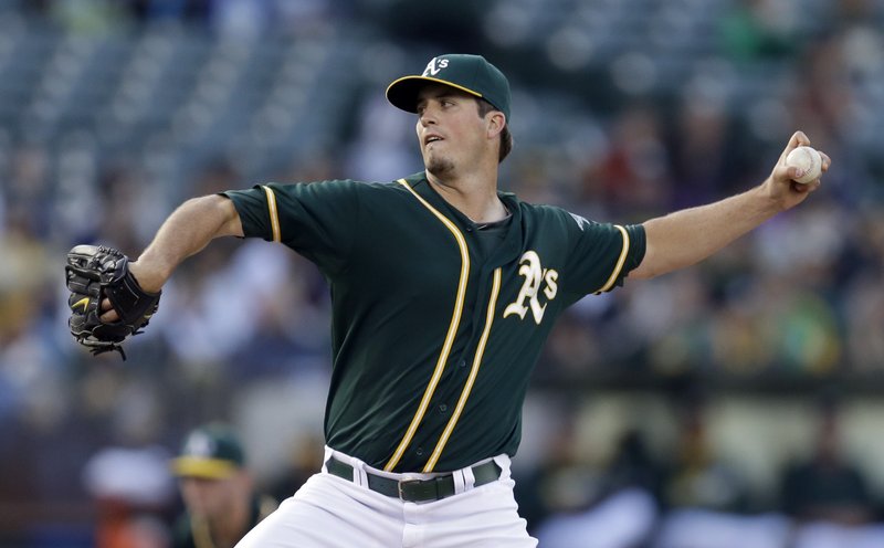 Oakland Athletics' Drew Pomeranz works against the Texas Rangers in the first inning of a baseball game Monday, June 16, 2014, in Oakland, Calif.