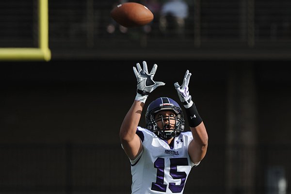 Fayetteville tight end C.J. O'Grady makes a catch during the annual spring Purple-White game Friday, May 30, 2014, at Harmon Stadium in Fayetteville. 