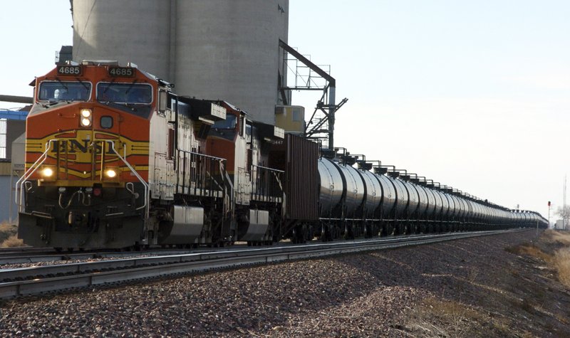  In this Nov. 6, 2013, file photo, a BNSF Railway train hauls crude oil near Wolf Point, Mont. Montana officials intend to release details next week on oil trains passing through the state despite efforts by railroads to keep the information from the public.