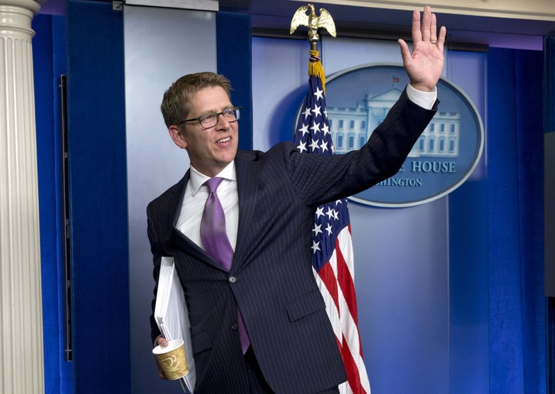 Outgoing White House press secretary Jay Carney waves following the conclusion of his final news briefing at the White House in Wednesday, June 18, 2014. This was Carney's last briefing to members of the media, he is stepping down as White House press secretary and Deputy Press Secretary Josh Earnest will step into the role.