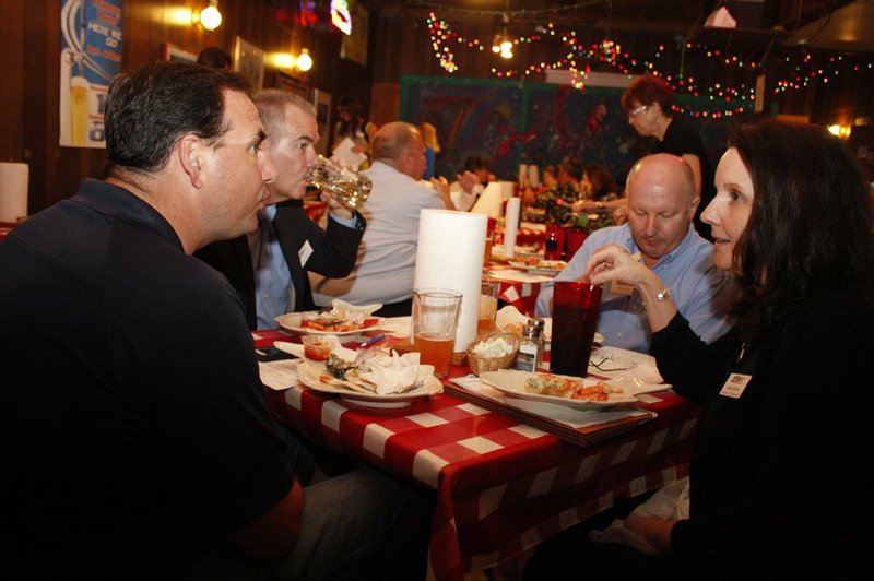 Arkansas Democrat-Gazette/BOBBY AMPEZZAN  6/10/14  Matt Rankins, David Conrad, Mike Cole and Karen Halbert at the Oyster Bar for the annual meeting of JDRF.