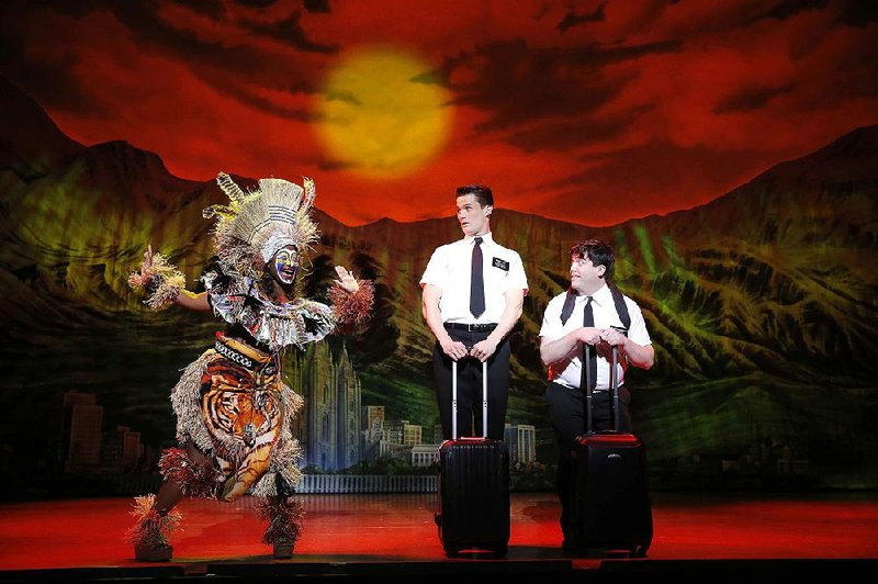 FILE — Phyre Hawkins (from left), Mark Evans and Christopher John O’Neill enact a scene from The Book of Mormon in this 2014 file photo.