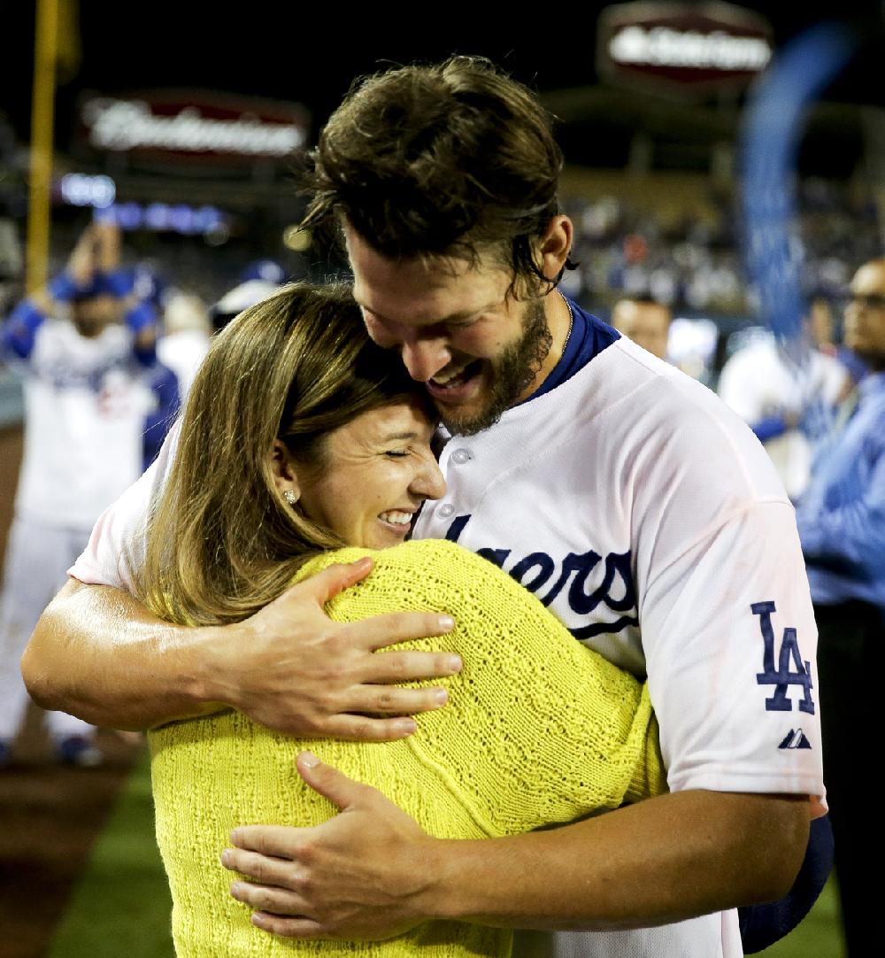 Los Angeles Dodgers starting pitcher Clayton Kershaw celebrates his no hitter with his with Ellen against the Colorado Rockies after a baseball game in Los Angeles, Wednesday, June 18, 2014. (AP Photo/Chris Carlson)