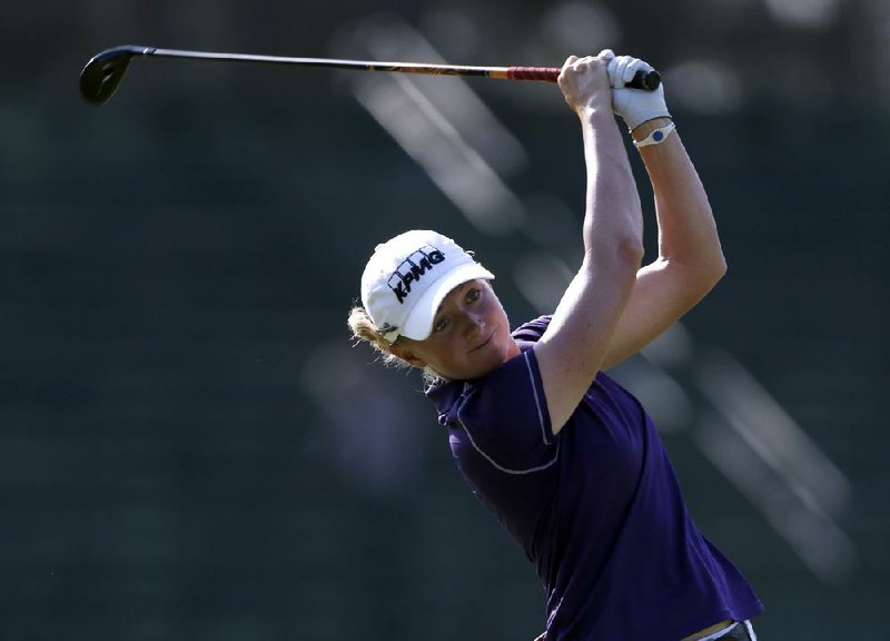 Stacy Lewis watches her tee shot on the 13th hole during the first round of the U.S. Women's Open golf tournament in Pinehurst, N.C., Thursday, June 19, 2014. (AP Photo/Bob Leverone)