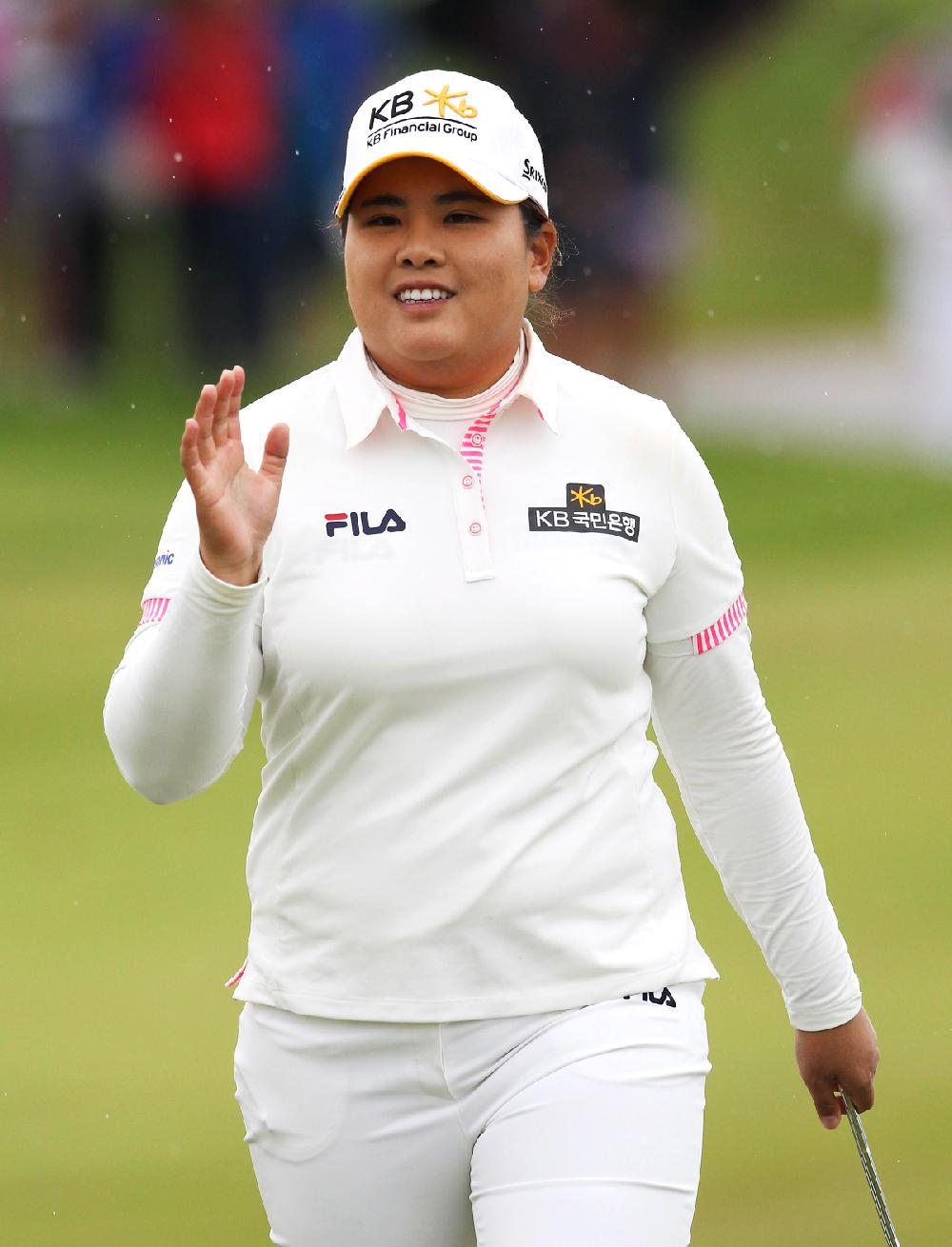 Inbee Park responds to the crowd after holing a birdie putt on the 14th hole at the Manulife Financial LPGA Classic golf tournament Sunday, June 8, 2014 in Waterloo, Ontario. (AP Photo/The Canadian Press, Dave Chidley)