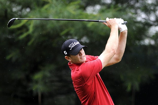 Brendan Steele watches his drive on the 10th tee during the first round of the Travelers Championship golf tournament in Cromwell, Conn., Thursday, June 19, 2014. (AP Photo/Fred Beckham)