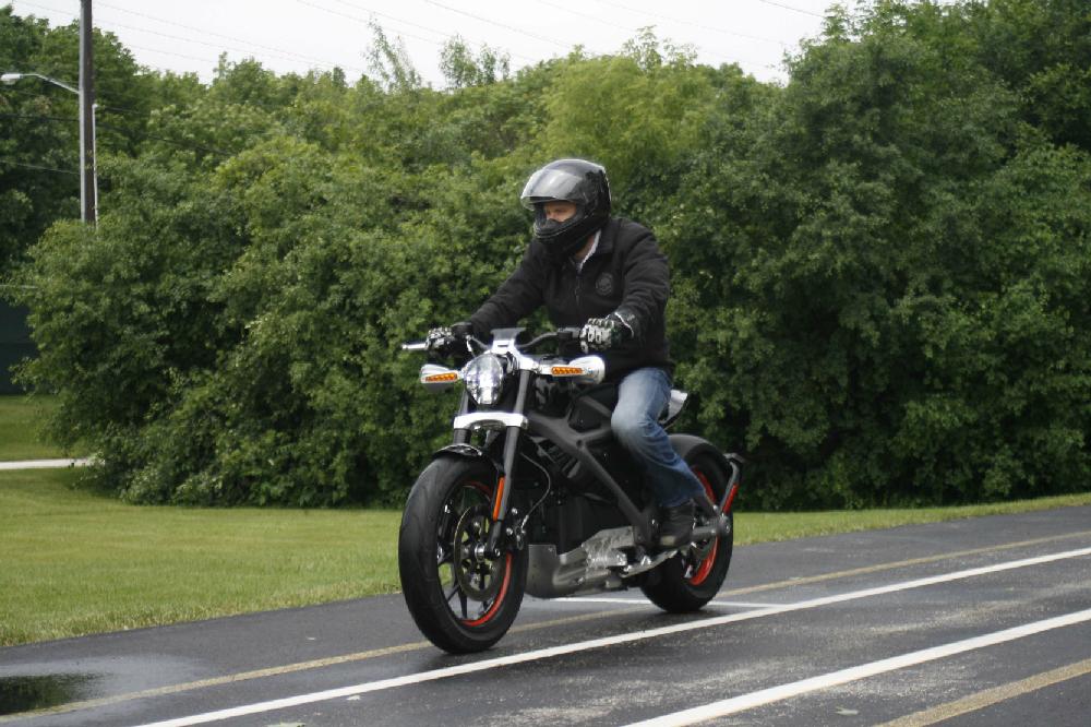 In this Wednesday, June 18, 2014 photo, employee Ben Lund demonstrates Harley's new electric motorcycle at Harley's research facility in Wauwatosa, Wis. The company plans to unveil the LiveWire model Monday, June 23, at an invitation-only event in New York. (AP Photo/M.L. Johnson)