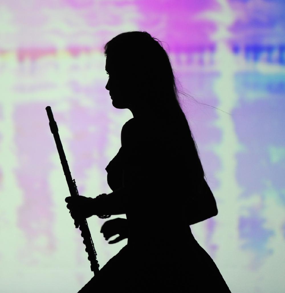Miss Arkansas Tech Universtiy Logan Moore awaits her flute solo run through during rehearsals of the Miss Arkansas Pageant at Summit Arena on Thursday, June 19, 2014. The second night of preliminary competititon continues tonight at 7 p.m. (The Sentinel-Record/Mara Kuhn)