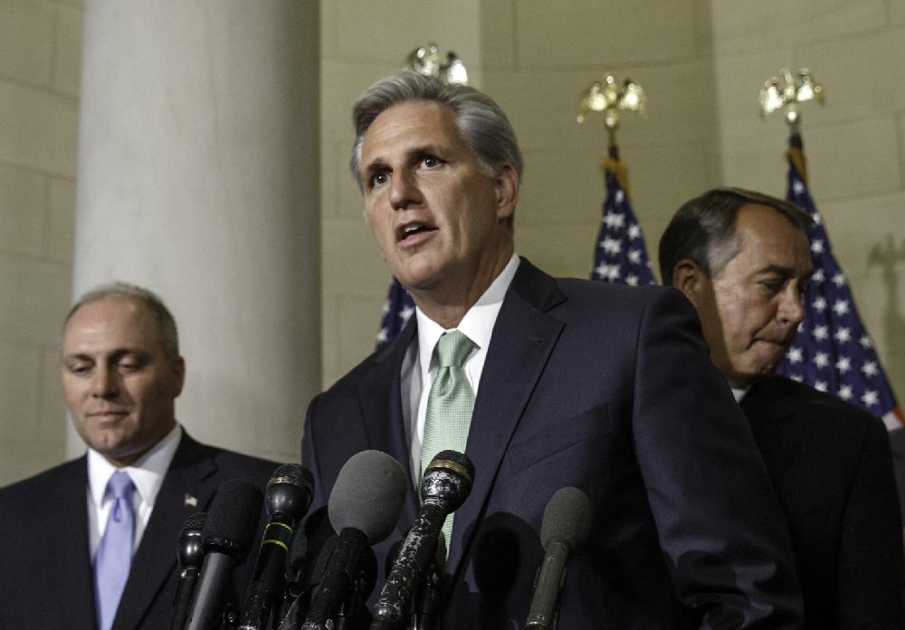 House Majority Whip Kevin McCarthy, R-Calif., is joined by Rep. Steve Scalise, R-La., left, and Speaker of the House John Boehner, R-Ohio, just after House Republicans voted to make McCarthy the new majority leader, replacing Rep. Eric Cantor, R-Va., who was defeated in his primary earlier this month, on Capitol Hill in Washington, Thursday, June 19, 2014. Rep. Steve Scalise, R-La., who leads a conservative faction of lawmakers in the Republican Study Committee, was elected to be the new House majority whip, replacing McCarthy. Scalise was in a three-way race with Rep. Peter Roskam, R-Ill., and Rep. Marlin Stutzman, R-Ind. (AP Photo/J. Scott Applewhite)