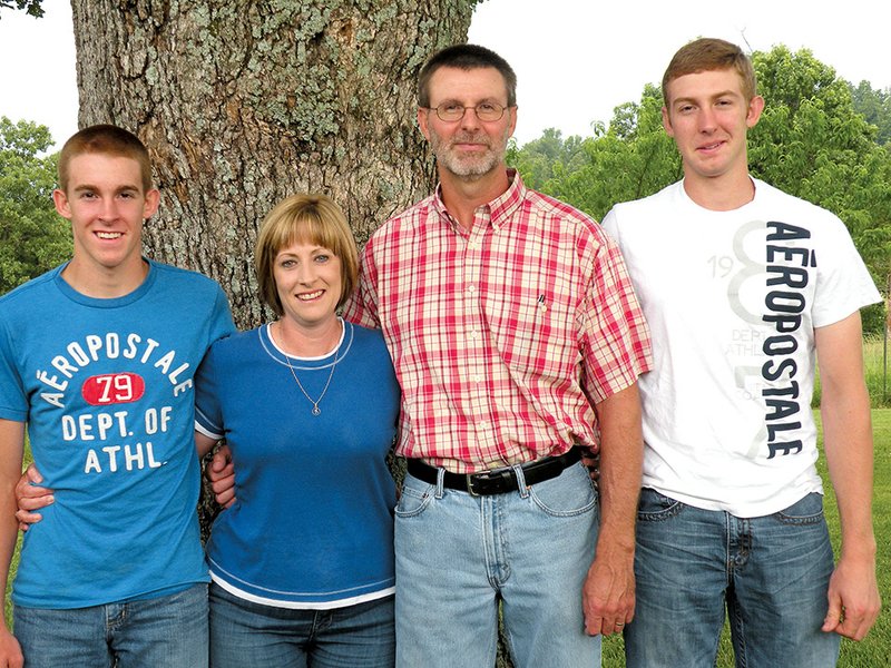 The Wade Powell family of the Fryatt community is the 2014 Fulton County Farm Family of the Year. Family members include, from left, Coltin, Sherry, Wade and Collin. The family raises hay and timber and has a cow/calf operation on 739 acres.