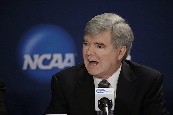 In this April 6, 2014, file phot, NCAA President Mark Emmert answers a question at a news conference in Arlington, Texas. Testifying in a landmark antitrust lawsuit filed against his organization, Emmert said Thursday, June 19, 2014, he believes there is a clear difference between the proposal to pay athletes a few thousand more dollars a year and giving them the equivalent of a salary. (AP Photo/David J. Phillip, File)