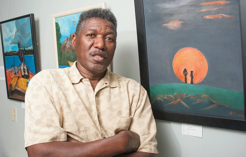 Richard Brim, an Arkadelphia native, stands beside some of his paintings that are currently on display at the Arkadelphia Art Center. Farrell Ford, director of the arts center, noted that Brim’s works have drawn attention because of “bold colors” and “scenes of everyday life.” Such attributes should not prove a surprise because Brim lists Norman Rockwell, a noted artist who captured American culture, as his biggest art influence.