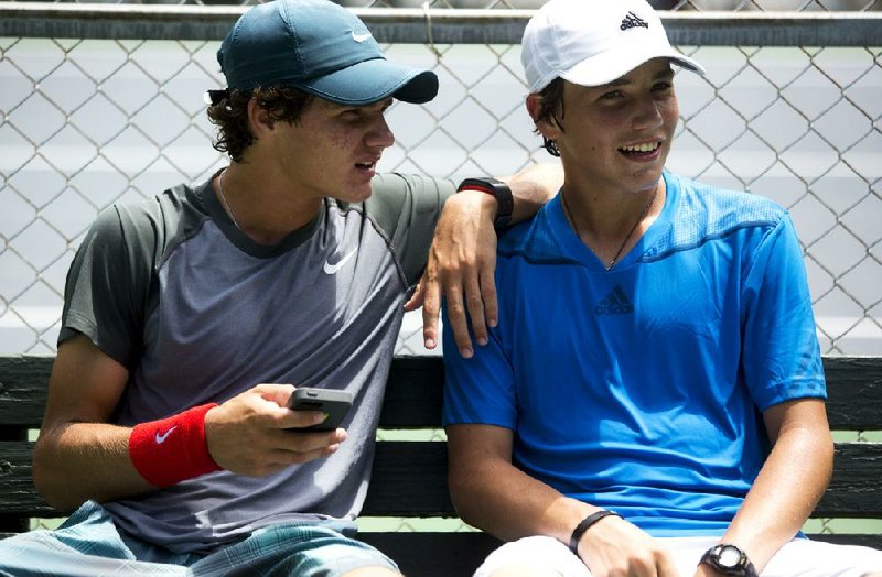 Arkansas Democrat-Gazette/MELISSA SUE GERRITS - 06/19/2014 - Trent Bryde, left, and Patrick Kypson talk after their match in the USTA Southern Closed 16's at Rebsamen Tennis Center June 20, 2014. 