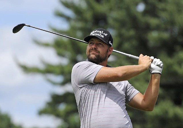 Ryan Moore shot a 66 in Saturday’s third round and leads the Travelers Championship by one stroke over Aaron Baddeley.