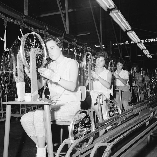Arkansas History Commission
Women test bicycle rims for "trueness" on June 19, 1963, during a visit by Arkansas Gazette columnist Ernie Deane to the assembly line of the AMF Cycle Division factory on 65th Street  in Little Rock.
