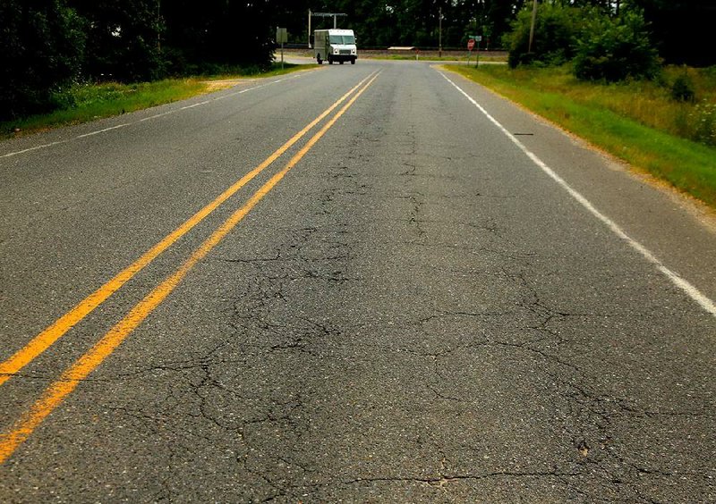 6/19/14
Arkansas Democrat-Gazette/STEPHEN B. THORNTON
A short stretch of highway 171 east off of U.S. 67 northeast of Malvern in Hot Spring County was named as one of the top 10 in poorest condition in the state.