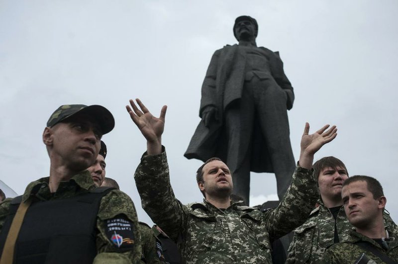 Pavel Gubarev, self-proclaimed governor of Donetsk in eastern Ukraine, gives a speech and an oath of allegiance to pro-Russia fighters Saturday in Donetsk’s Lenin Square. Gubarev said he had seen no sign of a cease-fire by Ukrainian forces.