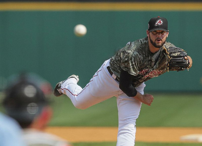 Arkansas Democrat-Gazette/BENJAMIN KRAIN --06/22/14--
Travelers relief pitcher Cam Bedrosian throws a strike to the last Springfield batter to earn a save during their 4-3 victory on Sunday at Dickey Stephens in North Little Rock