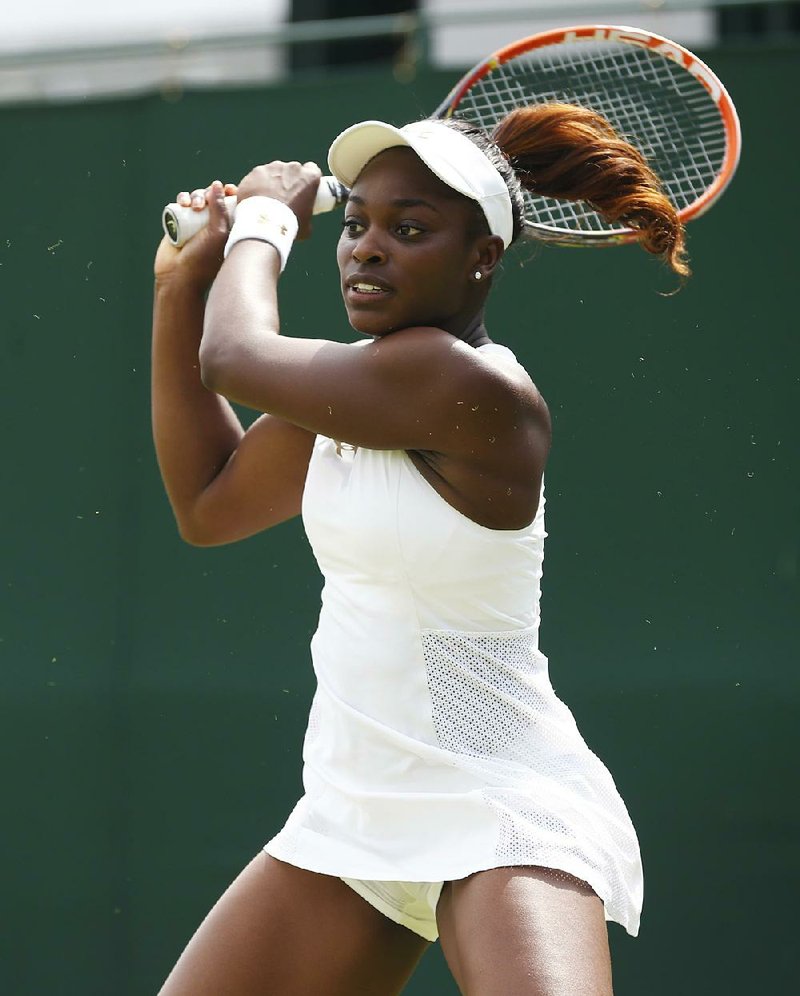 Sloane Stephens of the U.S. plays a return to Russia's Maria Kirilenko during their first round match at the All England Lawn Tennis Championships in Wimbledon, London,  Monday, June  23, 2014. (AP Photo/Pavel Golovkin)