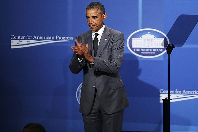 President Barack Obama applauds after speaking at The White House Summit on Working Families at a hotel in Washington, Monday, June 23, 2014. The gathering, organized by the White House, Department of Labor, and the Center for American Progress, highlights the challenges and offers solutions faced by working families in America. (AP Photo/Charles Dharapak)