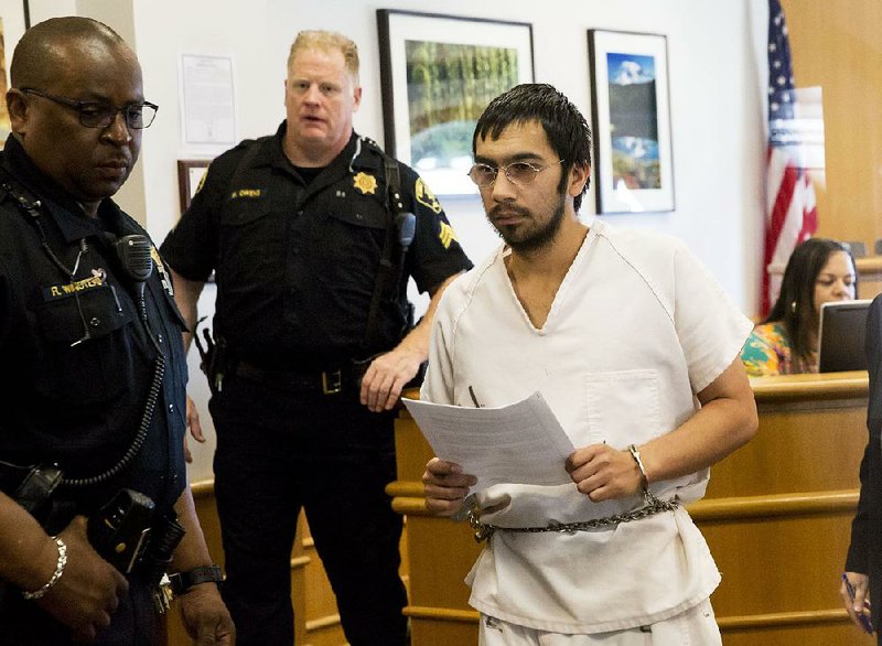 Aaron Rey Ybarra, accused of killing one student and wounding two others at Seattle Pacific University on June 5, appears in King County Superior Court in Seattle on Monday, June 23, 2014. Ybarra pleaded not guilty to premeditated first-degree murder and other charges. (AP Photo/The Seattle Times, Erika Scultz)  SEATTLE OUT; USA TODAY OUT; MAGS OUT; TELEVISION OUT; NO SALES; MANDATORY CREDIT TO BOTH THE SEATTLE TIMES AND THE PHOTOGRAPHER