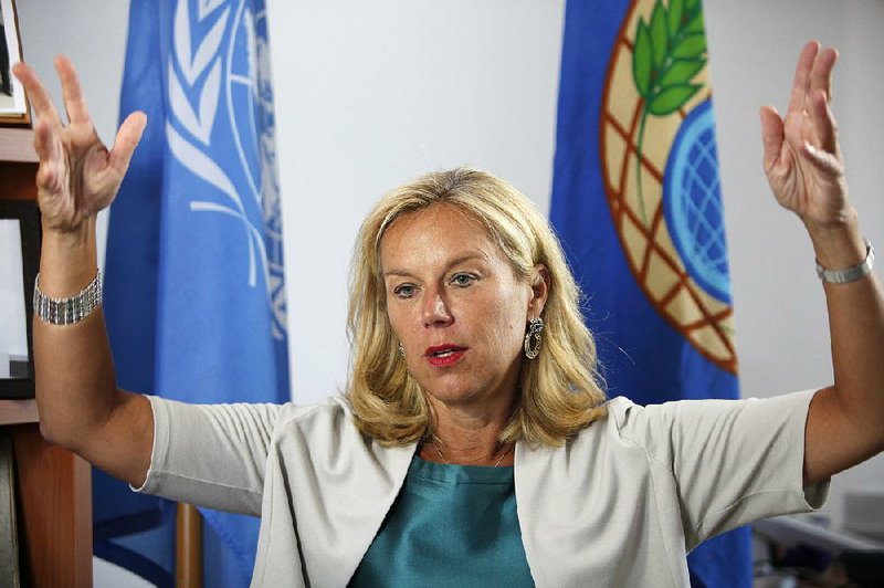 Sigrid Kaag, special coordinator of the Organisation for the Prohibition of Chemical Weapons (OPCW) for the UN speaks during an interview with Associated Press at a UN compound in the UN buffer zone in capital Nicosia, Cyprus, Monday 23, 2014. Kaag said that “100 percent” of Syria’s chemical weapons material has been removed or destroyed inside the war-torn country, hailing the development that beat a June 30th deadline as a significant milestone for the people of Syria and the region. (AP Photo/Petros Karadjias)