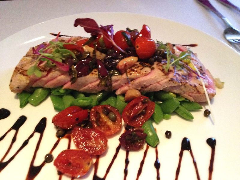 The Grilled Tuna Loin Nicoise comes with a pear-tomato-roasted garlic salsa at 1620 Savoy