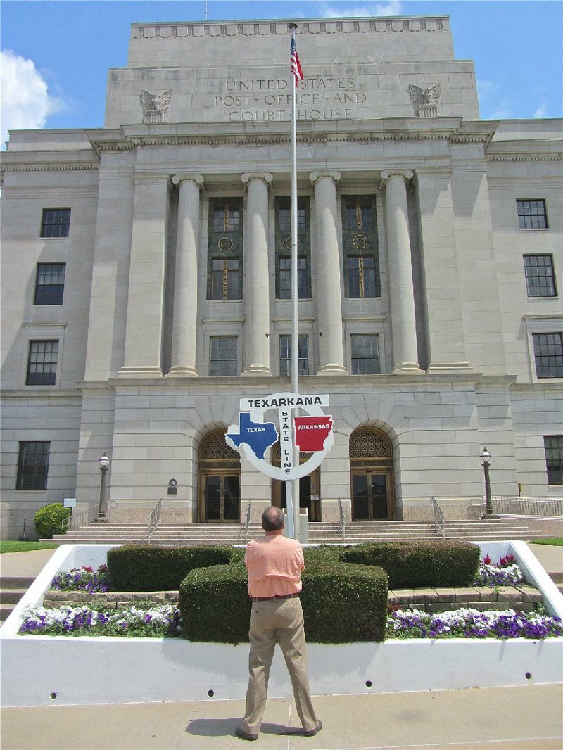 Visitors to Texarkana can stand in Arkansas and Texas outside the U.S. Post Office and Courthouse on the state line.