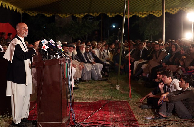 Afghanistan's presidential candidate Ashraf Ghani Ahmadzai, left, speaks for his allies, in front of media representatives, at his residence in Kabul, Afghanistan, Wednesday, June 25, 2014. Ashraf Ghani Ahmadzai, called on Abdullah to rejoin the process and demanded that the commission stick to the official timetable for releasing preliminary results next week. 