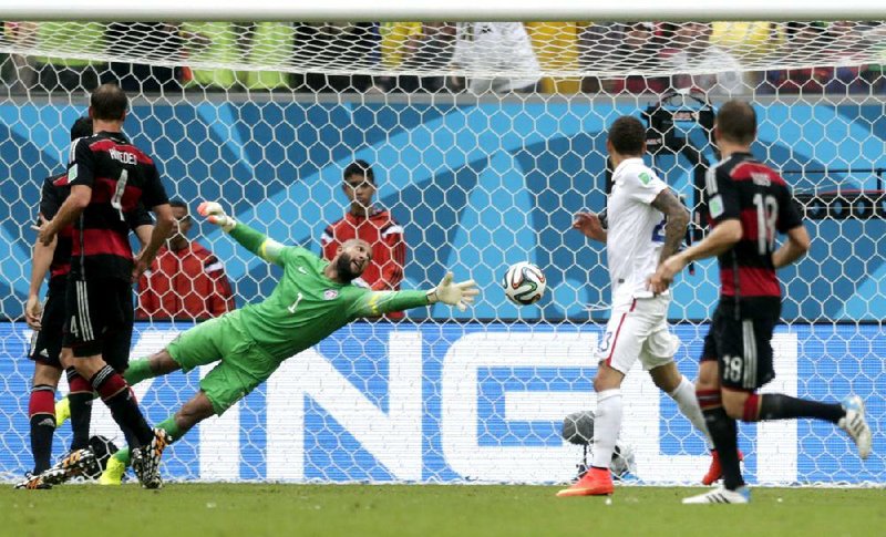 American goalkeeper Tim Howard can’t stop a rebound shot by Germany’s Thomas Mueller in the second half of Germany’s 1-0 victory Thursday in Recife, Brazil. Despite the loss, the United States advanced to the round of 16.