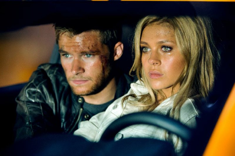 Shane Dyson (Jack Reynor) and Tessa Yeager (Nicola Peltz) contemplate the end of all human life in Transformers: Age of Extinction.