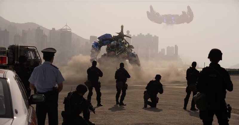 Optimus Prime (center) from TRANSFORMERS: AGE OF EXTINCTION.