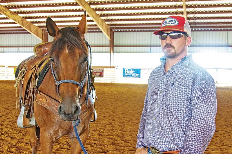 Chism Riddle, arena supervisor, stands with one of his horses at CrossRoads Cowboy Church and Two Bar Two Arena in El Paso. The church will host its first ranch rodeo on Saturday.
