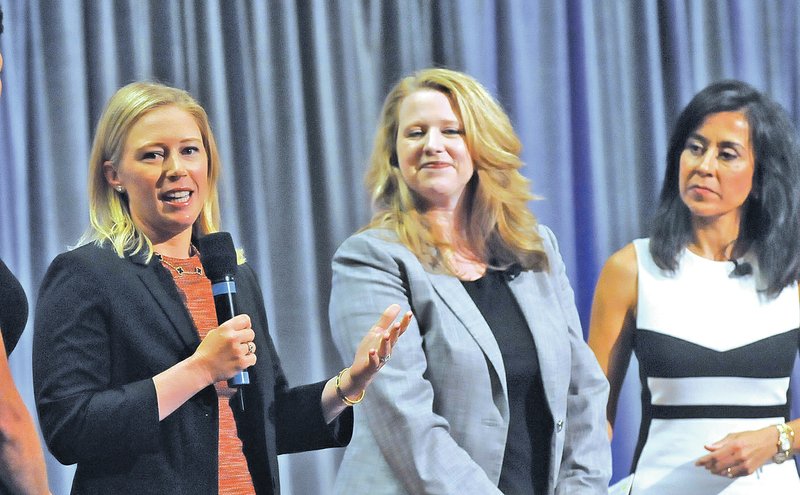 STAFF PHOTO FLIP PUTTHOFF BREAKFAST TALK Morgan Pressel, left, LPGA pro, speaks Thursday at the Network of Executive Women breakfast in Rogers. At center is Kristin Oliver, executive vice-president for people at Walmart. Gisel Ruiz, executive vice-president and chief operating officer at Walmart, is at right.