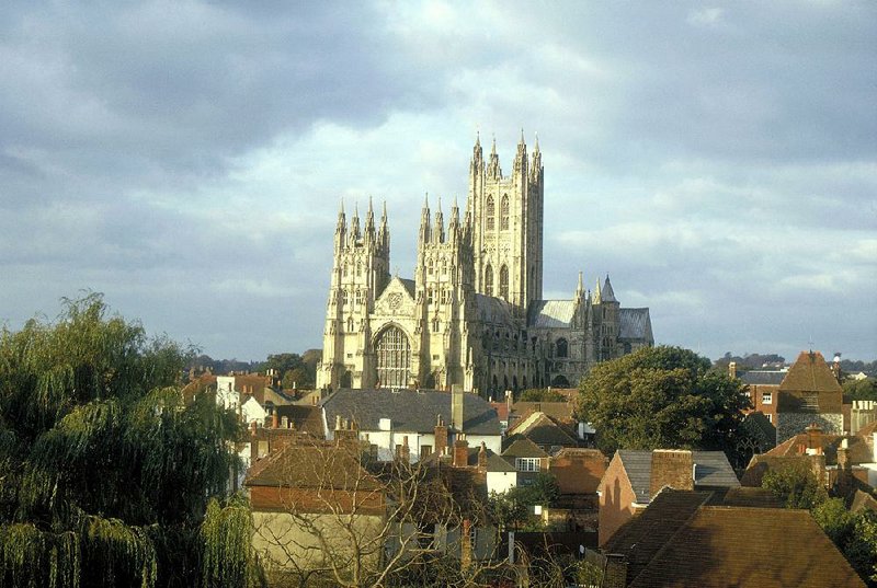 his undated image provided by Visit Britain shows Canterbury Cathedral looming over the rooftops and buildings of Canterbury, England. The ancient cathedral, where Archbishop Thomas Becket was martyred in 1107, remains a major pilgrimage site and tourist attraction, visited by a million people a year. (AP Photo/Visit Britain)