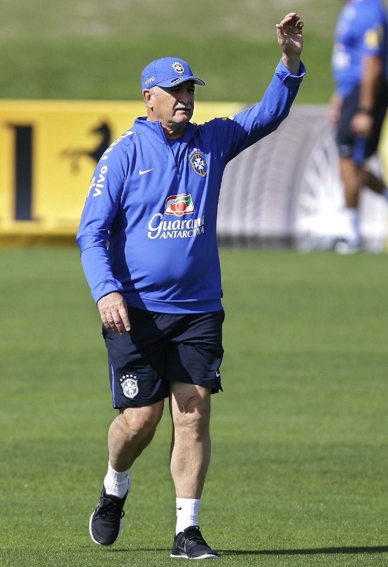 Brazil's coach Luiz Felipe Scolari gestures during a training session at the Granja Comary training center in Teresopolis, Brazil, Saturday, June 14, 2014. Brazil plays in group A at the 2014 soccer World Cup. (AP Photo/Andre Penner)