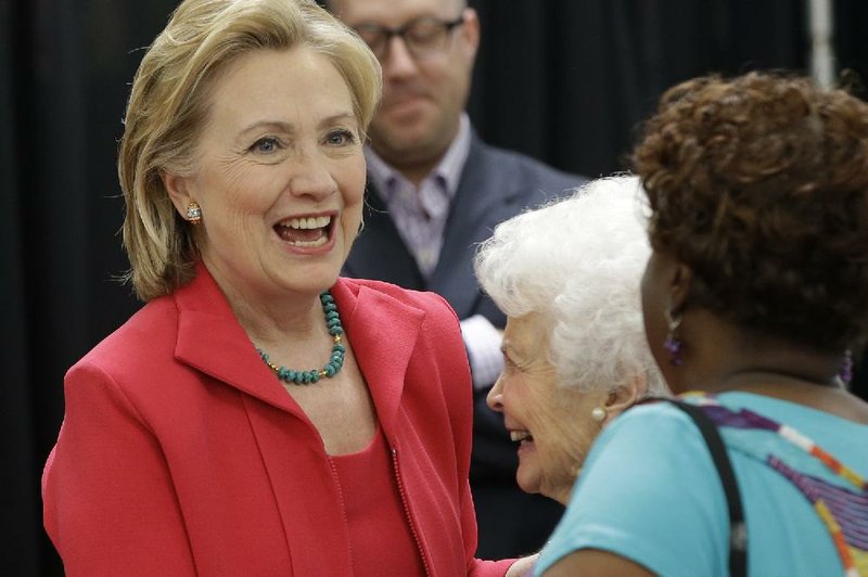 Former Secretary of State Hillary Rodham Clinton greets Mabel Harris-Webb at a book-signing in Little Rock on Friday. Harris-Webb, 95, knew Clinton when she was Arkansas’ first lady.