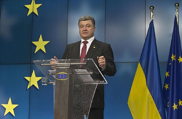 After signing an economic and political pact with the European Union, Ukrainian President Petro Poroshenko declared Friday in Brussels, “What a great day!”