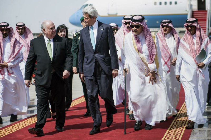 The United States’ envoy to Saudi Arabia, Joseph Westehal (left), walks with Secretary of State John Kerry and Saudi Foreign Minister Saud al-Faisal after Kerry’s arrival Friday in Jeddah. Kerry hopes to enlist the Saudi monarch in helping to form a new Iraqi government.